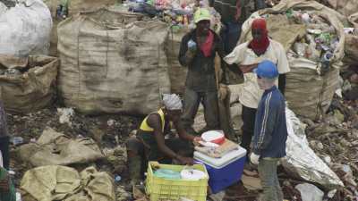 Men searching the garbage dump