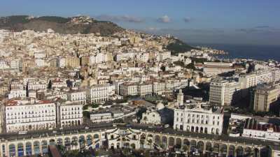 Arrival over Algiers city from the sea towards the Kasbah and the memorial