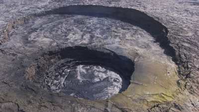 Slow approach of the Erta Ale volcano's lava lakes