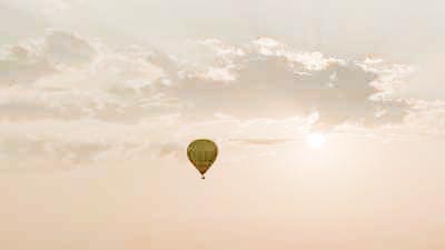 Air balloons move away at sundawn