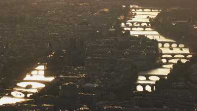 The seine and its bridges shine in the evening light