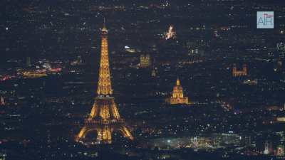 Paris at night with a wide sequence shot on the cityscape including the Eiffel tower