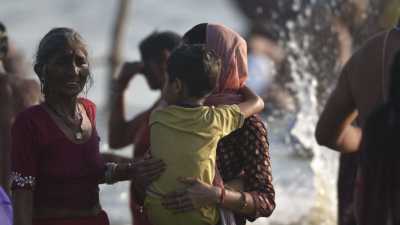 Women and their childrens during the bath of Kumbh Mela