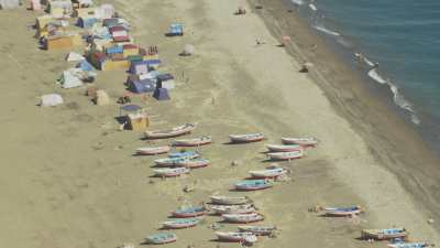 Boats and tents on Oued Laou beach