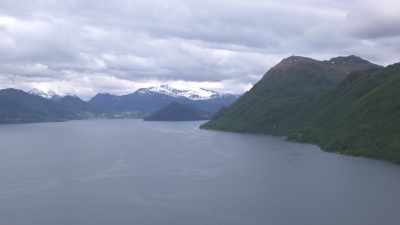 Flight over Norwegian fjord calm waters