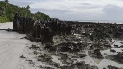 The beach with large coral pinnacles