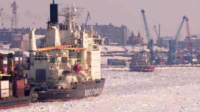 Icebreaker and cargo ships entering Doudinka harbor