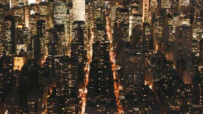 Illuminated Manhattan buildings and arteries at night