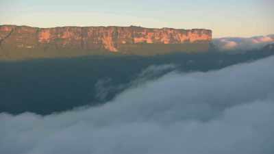 Mount Roraima appears over the clouds in the morning