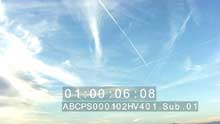 Cloudy and plane trails in the sky