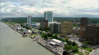 Two small planes fly above Windsor, ON, and Detroit,MI
