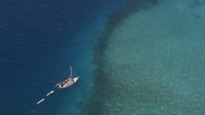 Small Fishing Sailboat with Conch Fishermen
