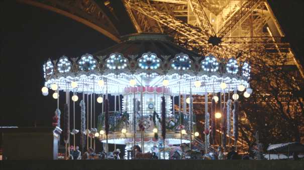 The Eiffel Tower seen from a boat at night
